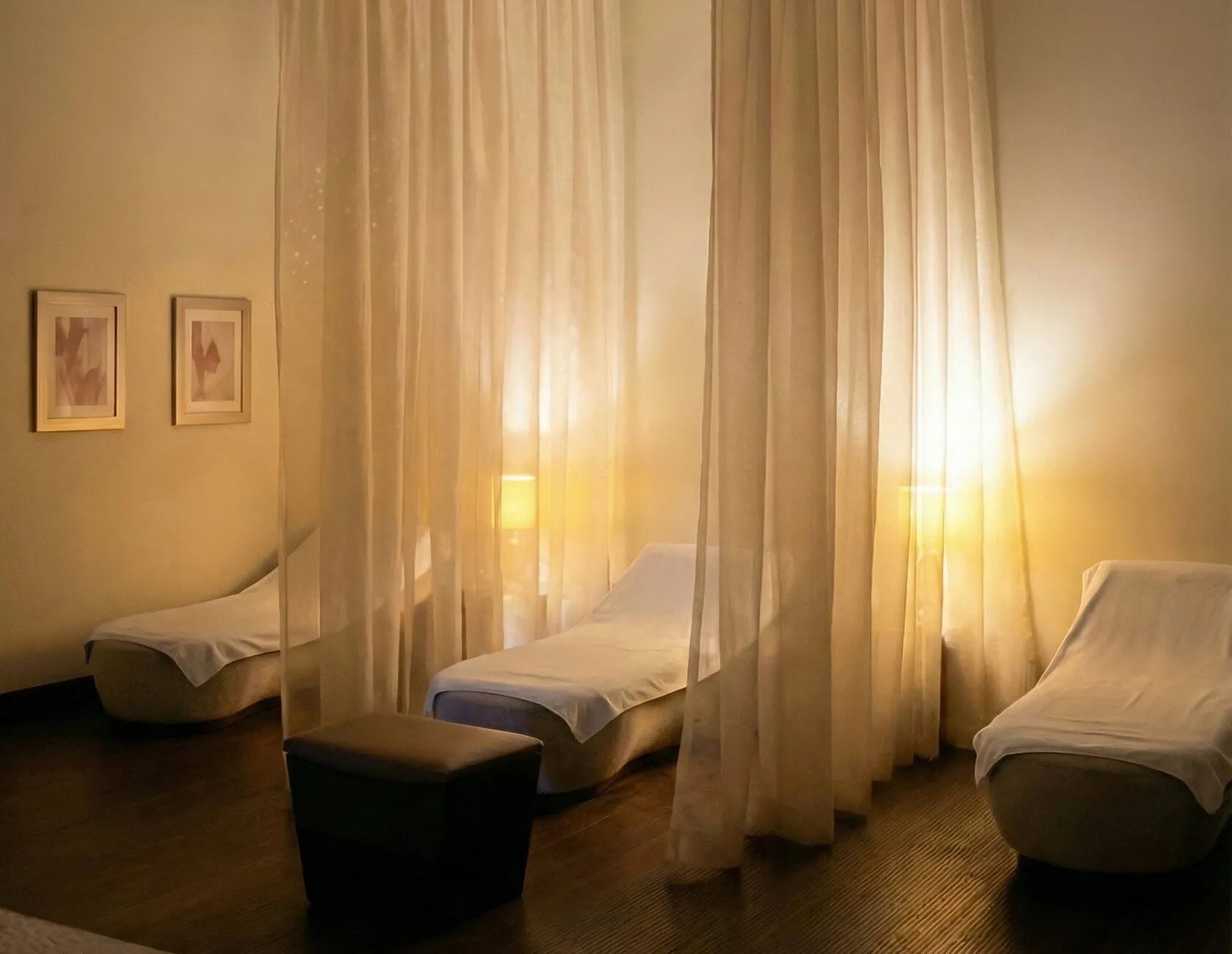 Candlelit relaxation lounge with flowing curtains at Doral Spa